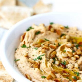 Chipotle Hummus with Roasted Pine Nuts is very simple and super delicious with a hint of smokiness from spicy chipotles and nice crunch from roasted pine nuts.
