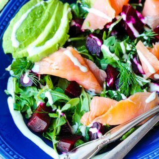 Smoked Salmon and Roasted Beets Salad with a Goat Cheese Dressing with avocado, vertical shot