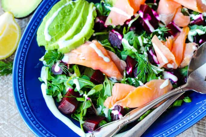 Smoked Salmon and Roasted Beets Salad with a Goat Cheese Dressing with avocado, vertical shot