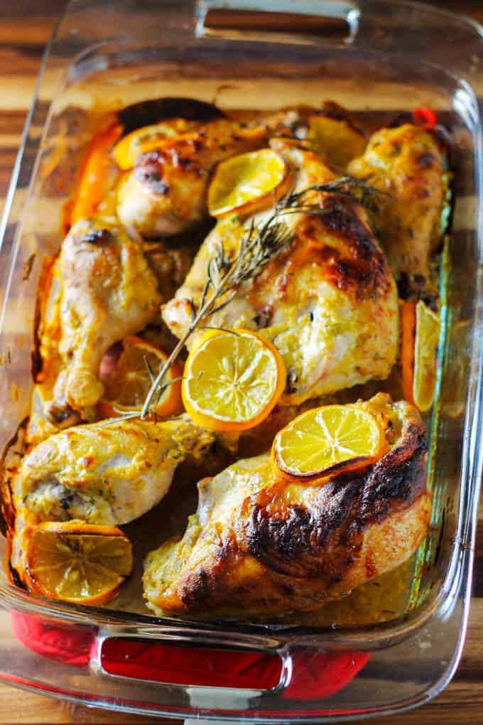 Meyer Lemon and Dijon Mustard Chicken with rosemary in a glass baking dish