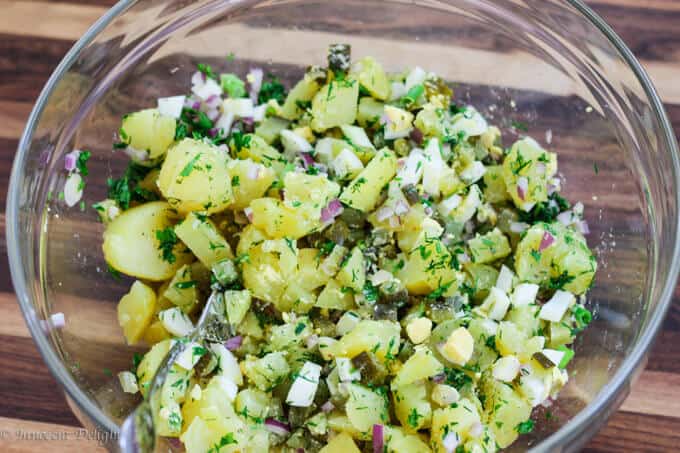 Potato Salad with Eggs and Pickles is super easy to make and it tastes incredible. The combination of eggs, pickles and an assortment of herbs make for a decadent, yet simple and unique dish.