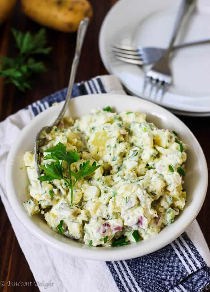 Potato Salad with Eggs and Pickles is super easy to make and it tastes incredible. The combination of eggs, pickles and an assortment of herbs make for a decadent, yet simple and unique dish.