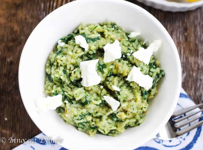 Greek Rice with Spinach served in a bowl with Feta Cheese 