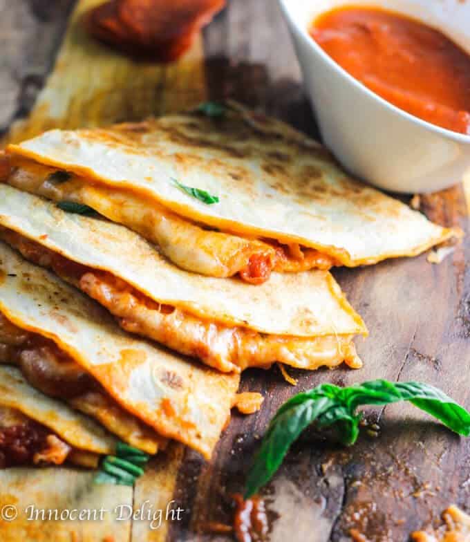 Margarita Pizza Quesadillas combine two of the most popular Italian and Mexican dishes - pizza and quesadillas. Listen, if 1 is good...2 is better!