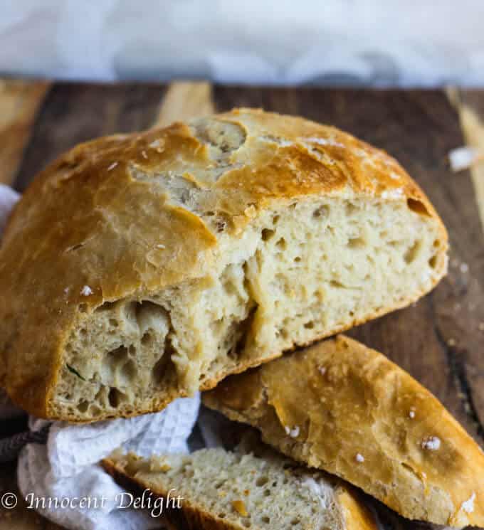 Homemade Dutch Oven Crusty Bread on a cutting board