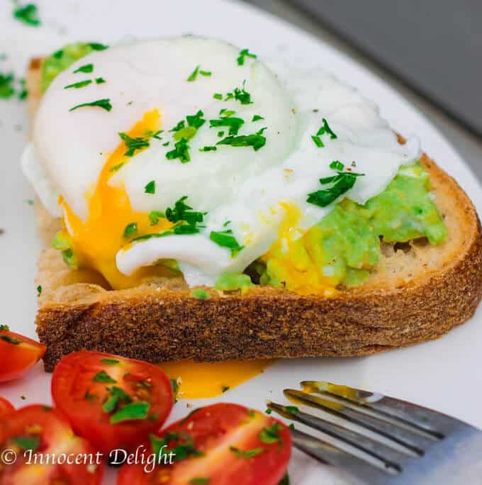 Smashed avocado and poached eggs on toast