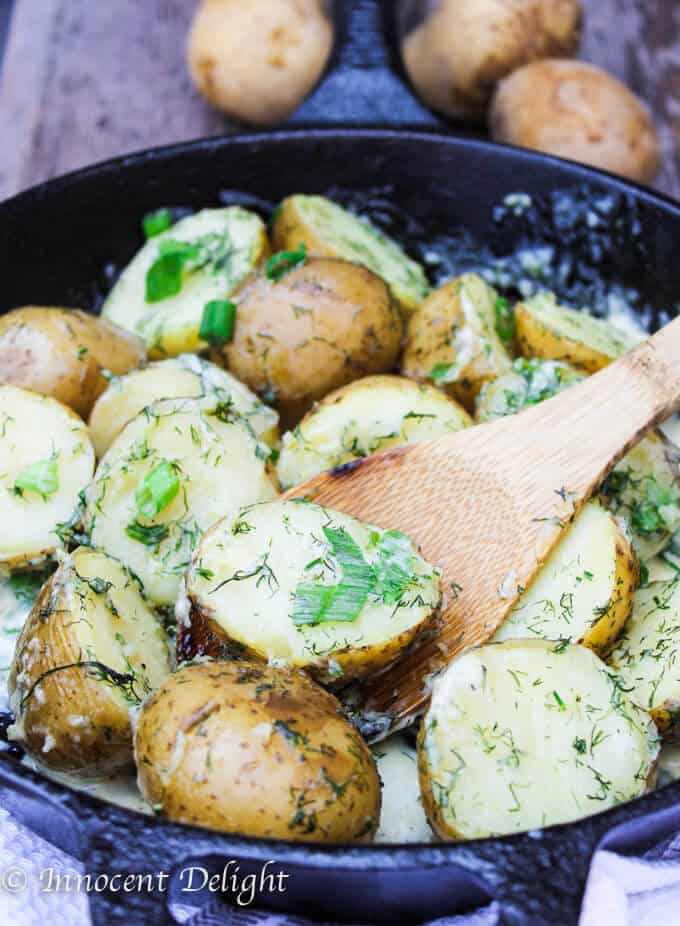 New Dill Potatoes with Scallion Cream Sauce - Polish summer staple side dish. This type of potatoes are the creamiest out there and they are only available for the short period of time. Hurry up, get some on your local farmer's market and follow this recipe to try the best potatoes you have ever tasted.