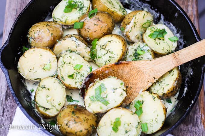 New Dill Potatoes with Scallion Cream Sauce - Polish summer staple side dish. This type of potatoes are the creamiest out there and they are only available for the short period of time. Hurry up, get some on your local farmer's market and follow this recipe to try the best potatoes you have ever tasted.