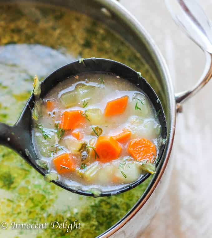 Polish pickle soup in a pot with soup spoon