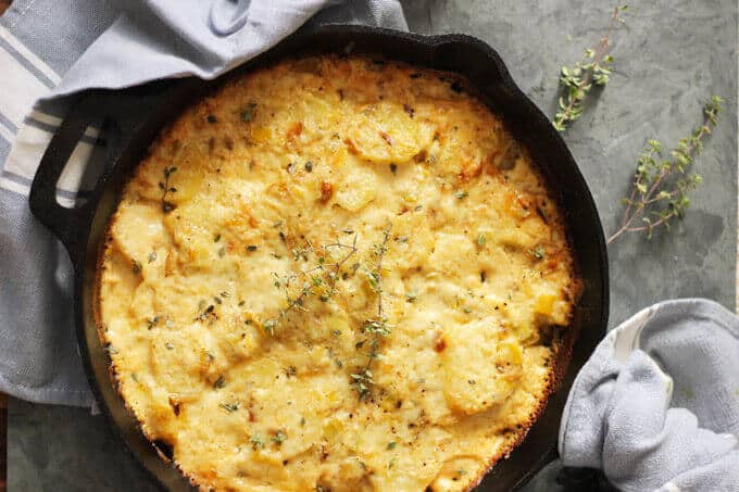 Potato Leek Casserole - ultimate comfort food side dish that resembles in taste famous Potato Leek Soup; topped with cream and Gruyer Cheese, rich, decadent, elegant and delicious casserole- Innocent Delight
