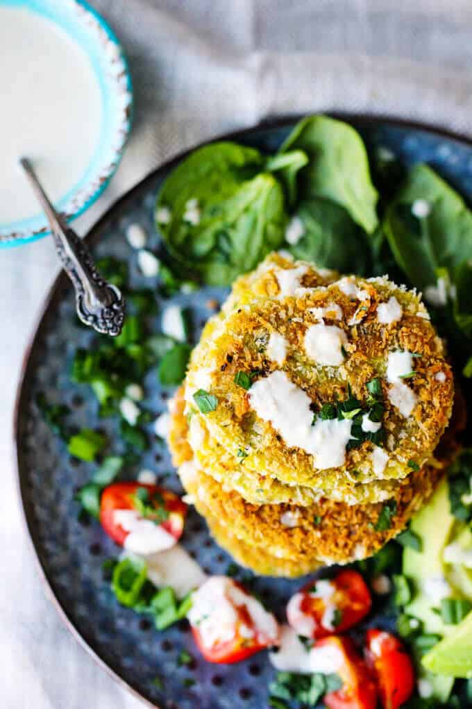 These Chickpea Egg Fritters with Tahini Sauce is a vegetarian treat for either lunch or dinner. It can be served with simple side veggies like avocados, greens and tomatoes, and in a pita bread or on a bun. The choice is yours. 