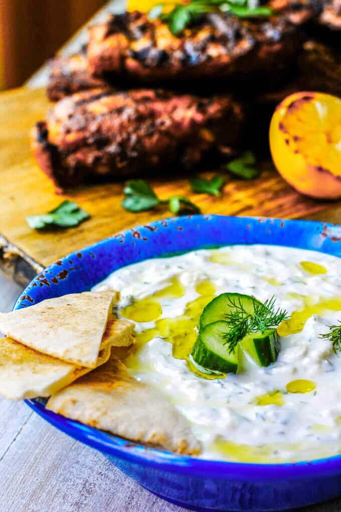 Traditional Greek Tzatziki Recipe combines real thick greek yogurt, seedless cucumber, garlic, dill and splash of vinegar and olive oil. It's a perfect sauce that can be paired with any meals like: grilled meats, vegetables, sandwiches, pitas or salads.