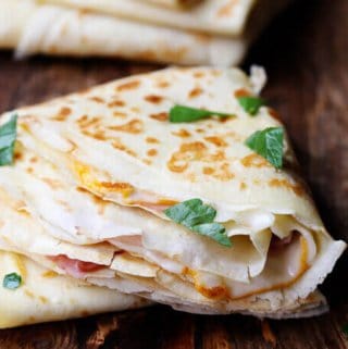 Ham and Cheese Crepes are one of the most famous French street foods. Simple batter from flour, milk, eggs and butter can make amazing perfect crepes. Fill them up with sliced ham and melting cheese and you can feel like on the corner of the French street.