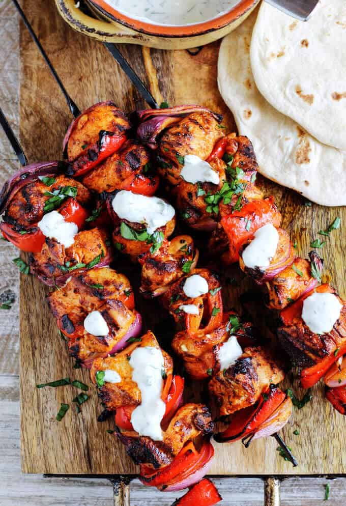 Mediterranean Chicken Kebabs with Garlic Yogurt sauce are packed with flavor. Marinated in Mediterranean spices, garlic and lemon, grilled to perfection and topped with cooling garlic yogurt sauce these chicken skewers are real winners.