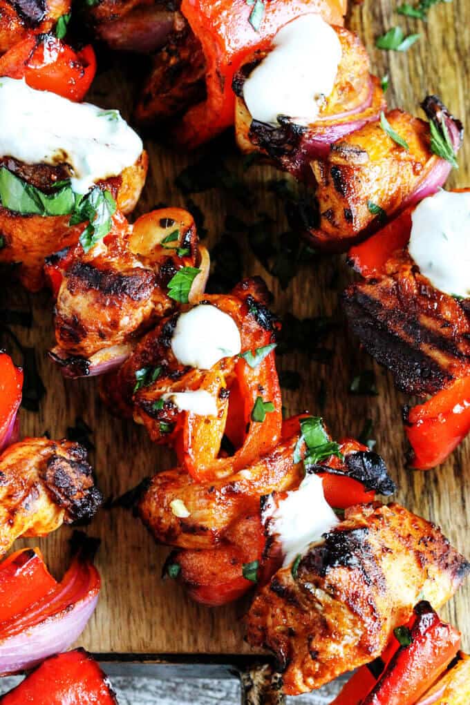 Mediterranean Chicken Kebabs with Garlic Yogurt sauce are packed with flavor. Marinated in Mediterranean spices, garlic and lemon, grilled to perfection and topped with cooling garlic yogurt sauce these chicken skewers are real winners.