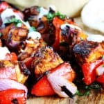 Mediterranean Chicken Kebabs with Garlic Yogurt sauce are packed with flavor. Marinated in Mediterranean spices, garlic and lemon, grilled to perfection and topped with cooling garlic yogurt sauce these chicken skewers are real winners.