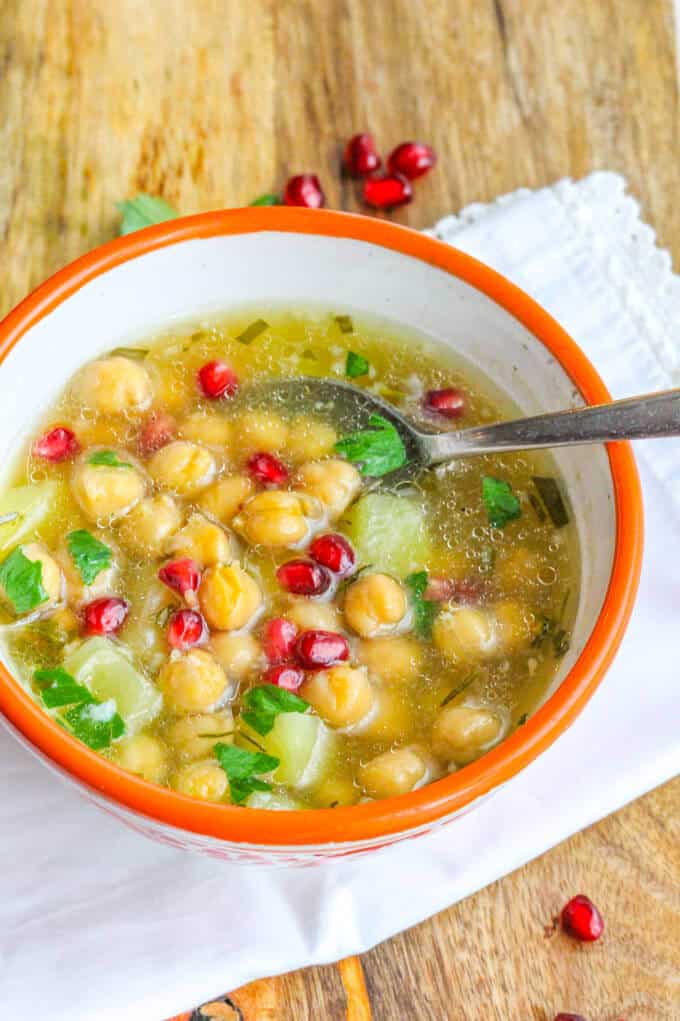 Greek Chickpea Soup in a bowl with spoon.