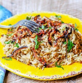 Lebanese Mujadara Recipe combines lentils with rice for a perfect protein meal. Seasoned with Middle Eastern flavors and topped with crispy fried onions makes for a truly irresistible dish.