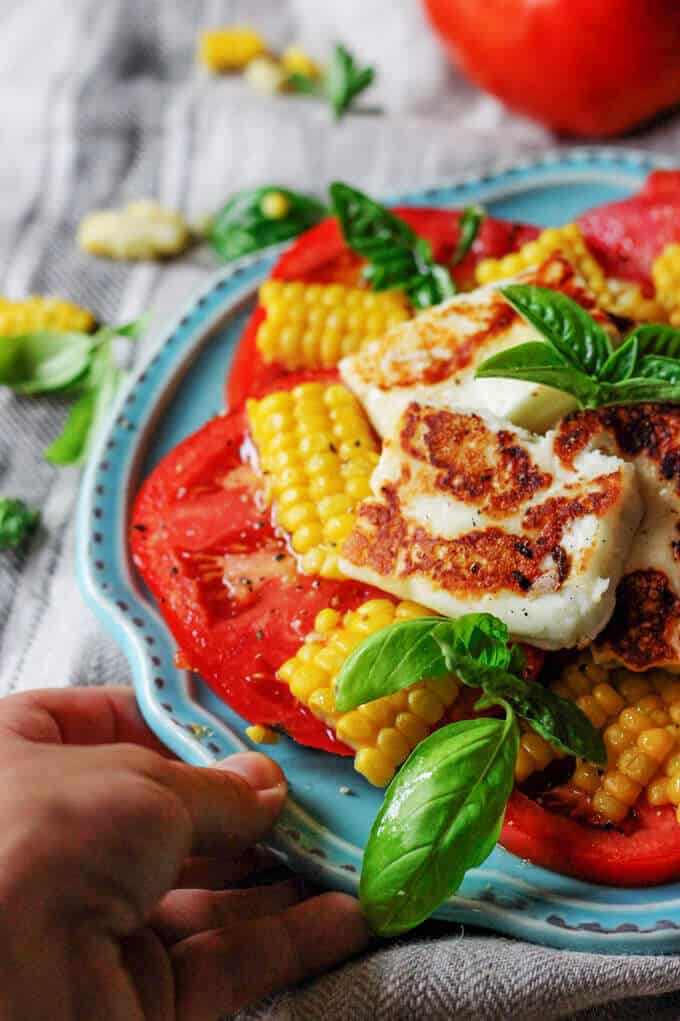 Fried Halloumi Cheese with Corn and Tomatoes is an amazing summer appetizer. This humble cheese from Cyprus will make for an unforgettable experience.