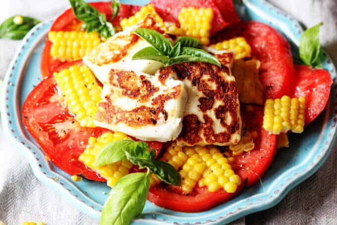 Fried Halloumi Cheese with Corn and Tomatoes is an amazing summer appetizer. This humble cheese from Cyprus will make for an unforgettable experience.