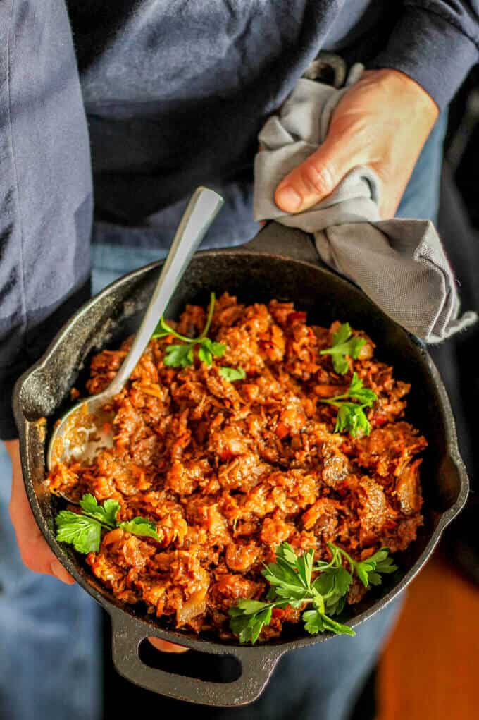 Bigos - Polish Hunter Stew - is a traditional Polish dish that originated in Medieval times. Sauerkraut, Kielbasa, Wild Mushrooms, Prunes and spices are braised in red wine for hours.