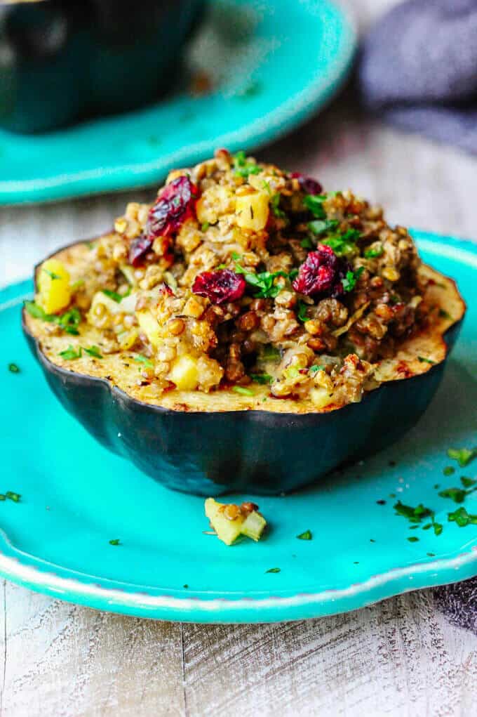 Lentils Stuffed Acorn Squash with apples and dried cranberries is a perfect vegetarian dish that combines all the favourite fall flavors in every bite. 