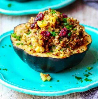 Lentils Stuffed Acorn Squash with apples and dried cranberries is a perfect vegetarian dish that combines all the favourite fall flavors in every bite. 