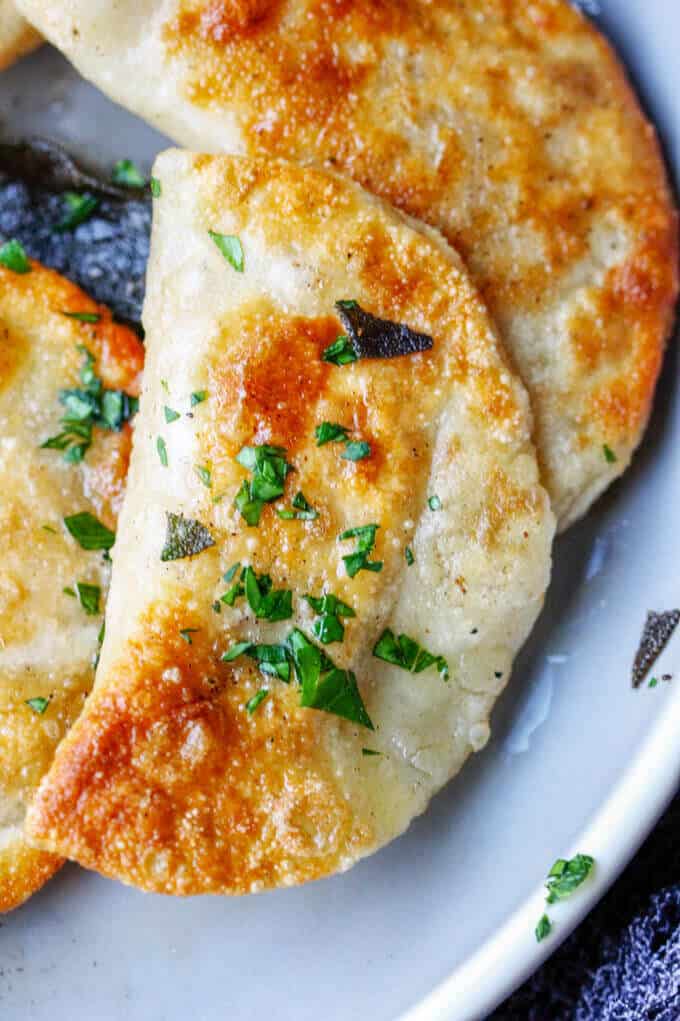 Roasted Butternut Squash Feta Pierogi is an amazing dish that combines American fall flavors with a taste from the Greek islands, wrapped in Polish dough