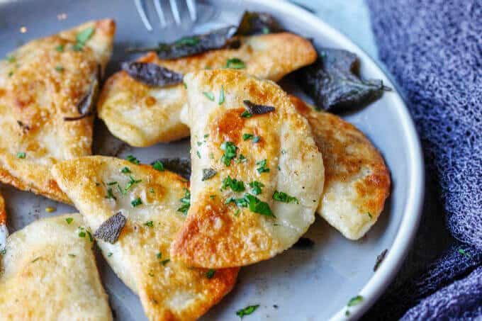 Roasted Butternut Squash Feta Pierogi is an amazing dish that combines American fall flavors with a taste from the Greek islands, wrapped in Polish dough