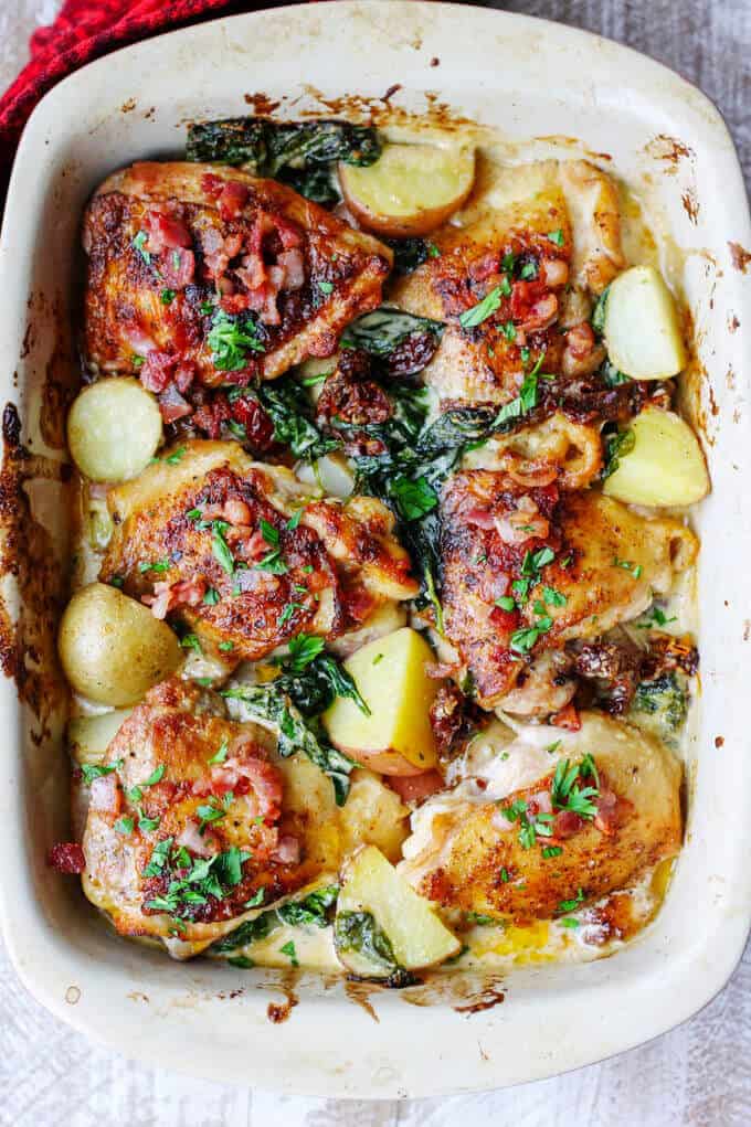Tuscan chicken and potatoes casserole with sun dried tomatoes, overhead shot