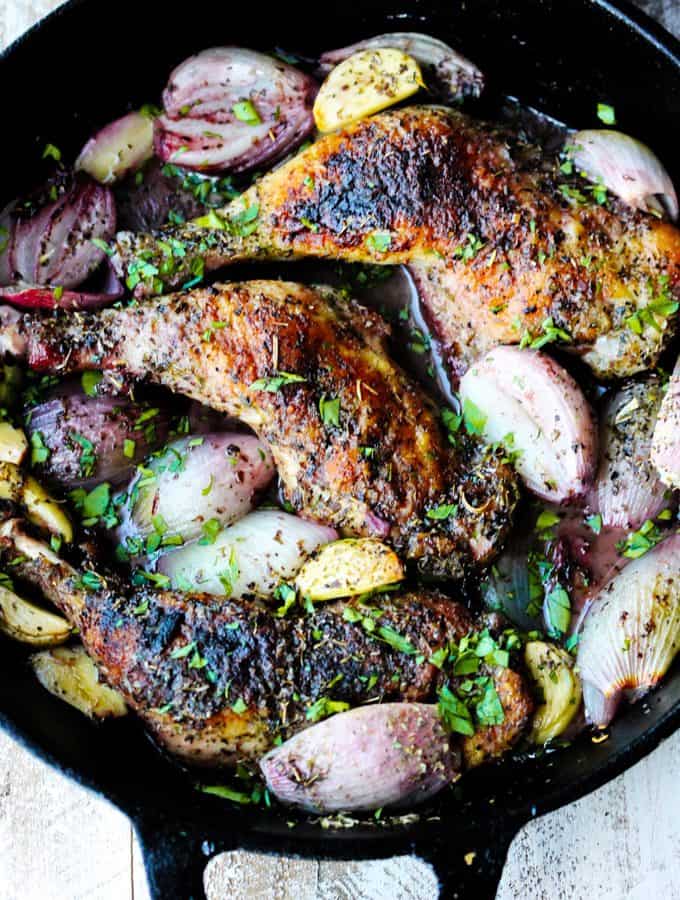 Chicken Provencal in a skillet with shallots, garlic and herbs de Provence