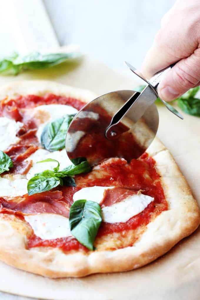 Cutting the Margherita pizza 