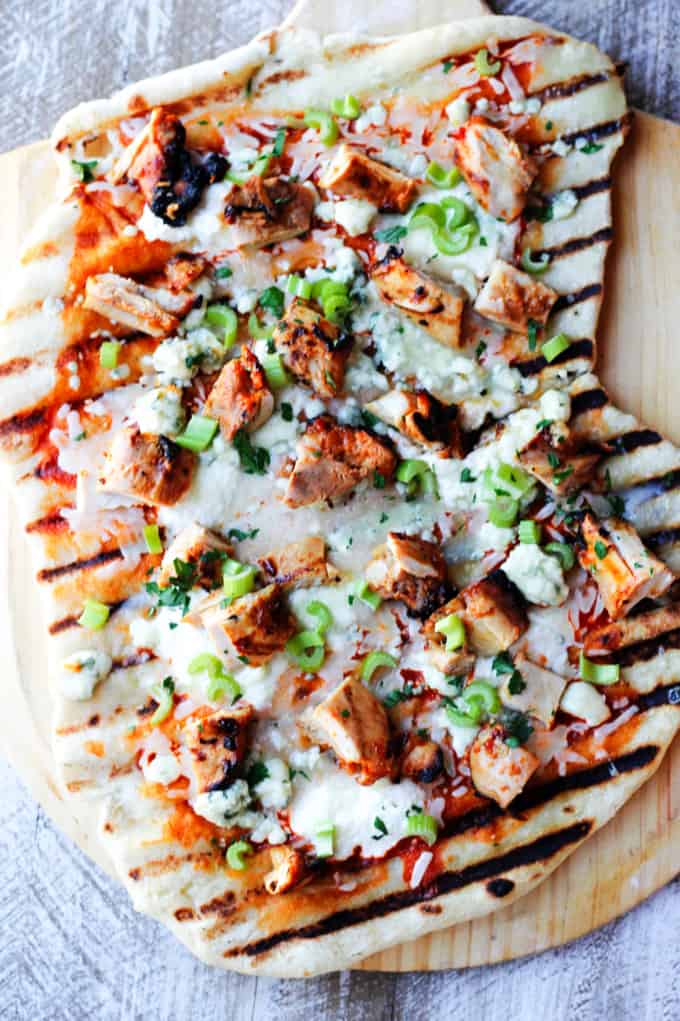 Buffalo Chicken Grilled Pizza on a pizza peel