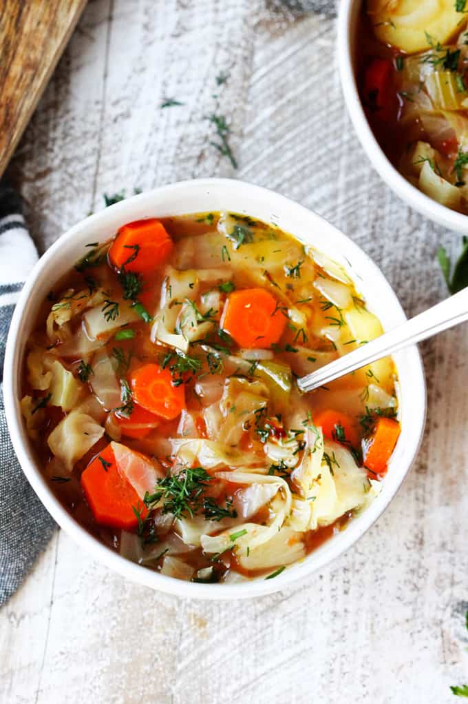 Crockpot cabbage soup in a bowl with spoon.