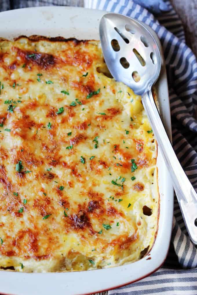 Provencal Squash Gratin in a casserole dish with serving spoon