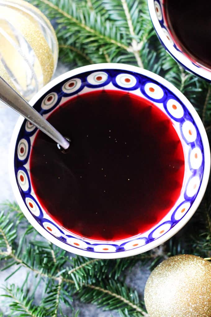Borscht in a bowl with a spoon and a Christmas decoration