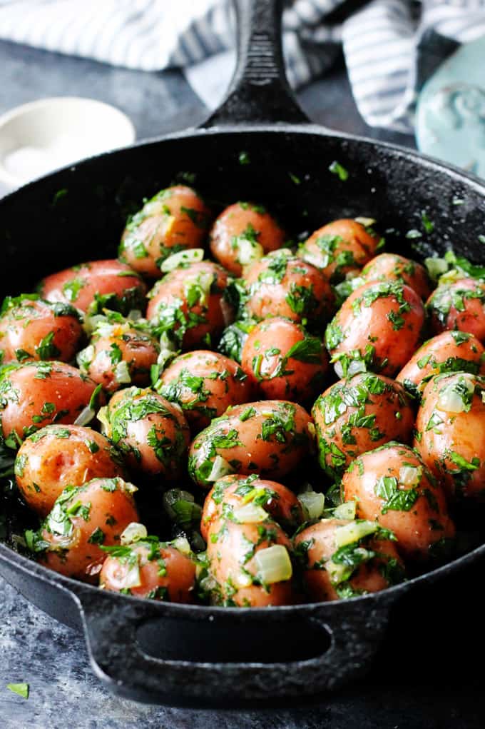 Parsley potatoes in cast iron skillet