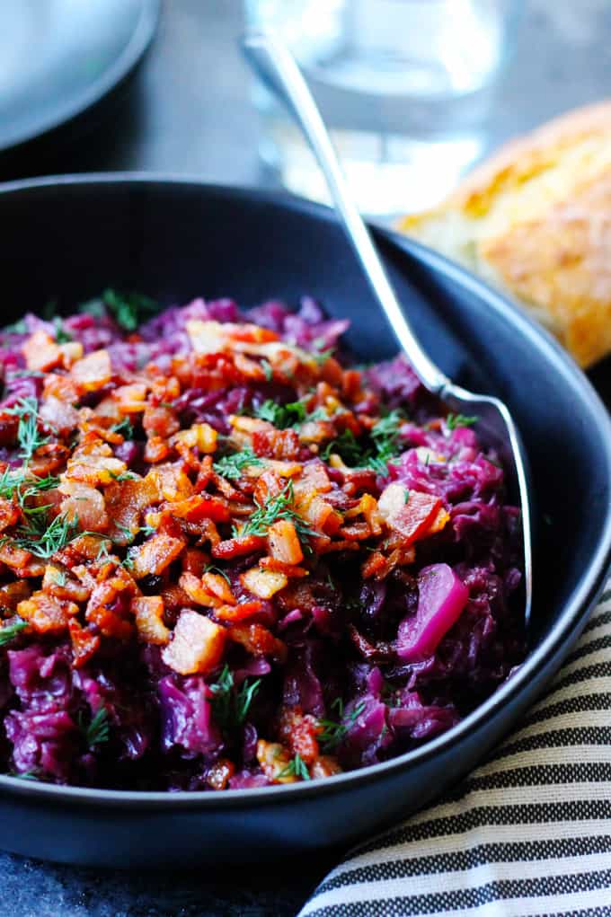 German Braised Red Cabbage in a black bowl with spoon