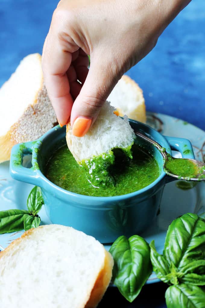 Dunking bread in a basil sauce