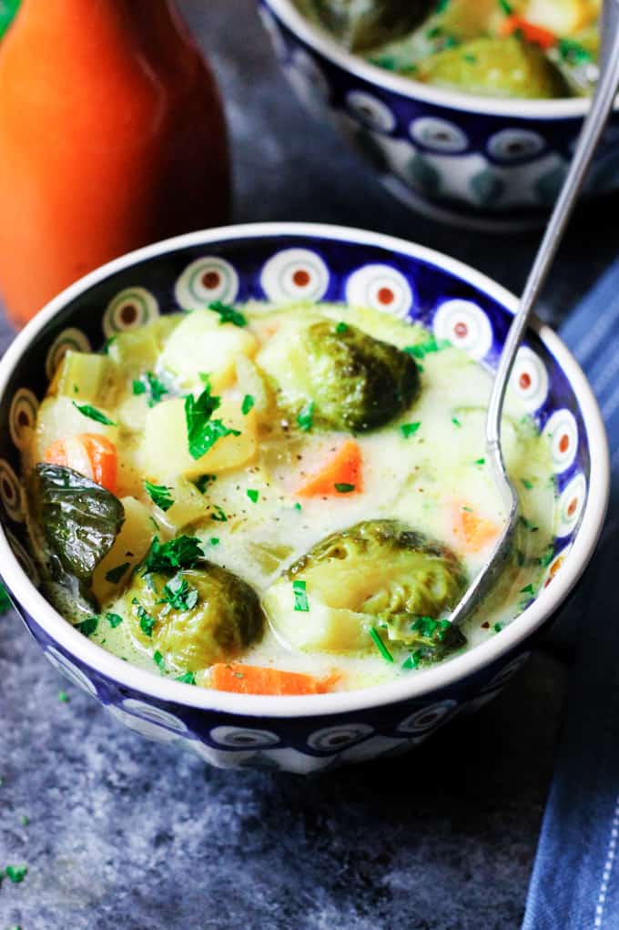 Brussels sprouts soup in a bowl with spoon