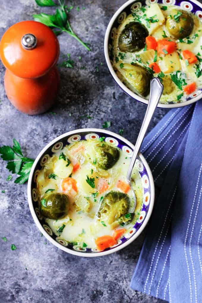 Overhead shot of two bowls with brussels sprouts soup.