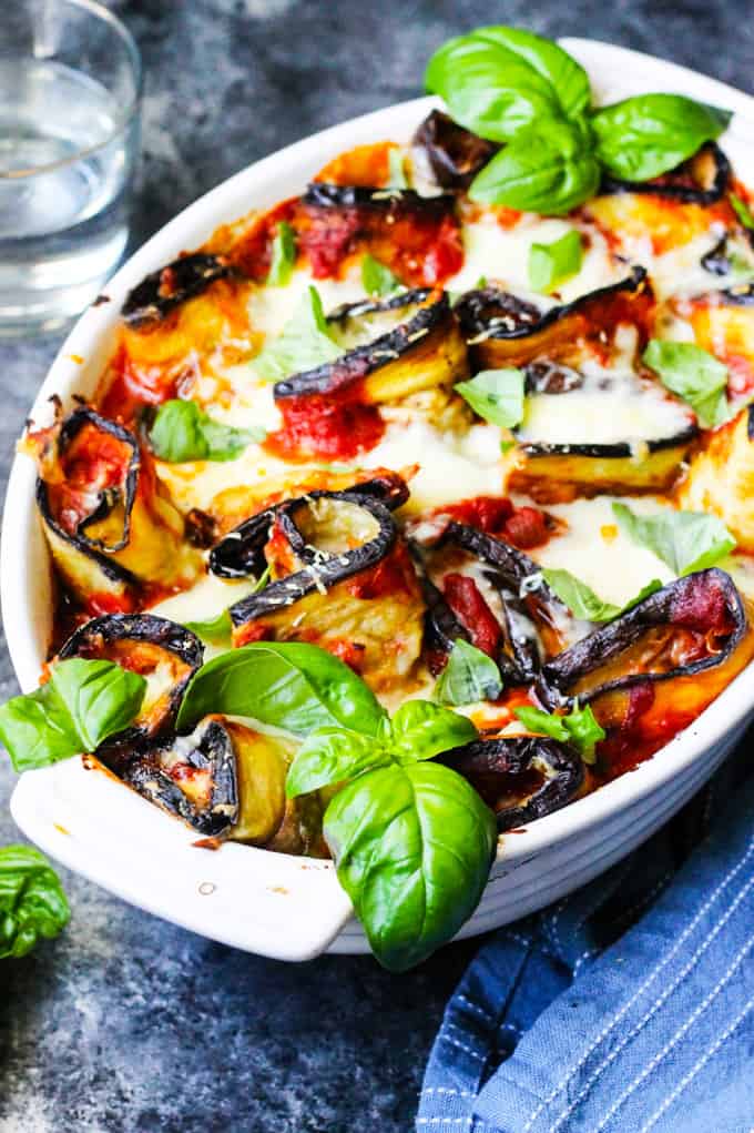 Eggplant Parmigiana Roll ups in casserole dish