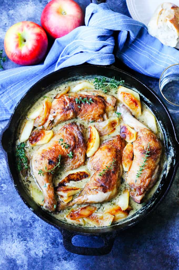 Chicken normandy with apples in a cast iron skillet. 
