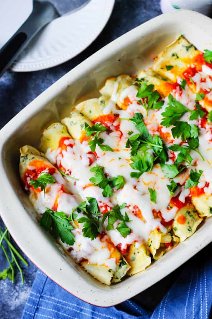 Chicken Savory Crepes in a baking dish with cheese and parsley