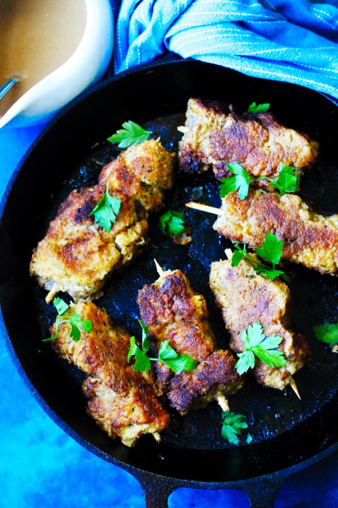 City Chicken (breaded pork on skewers in a skillet)