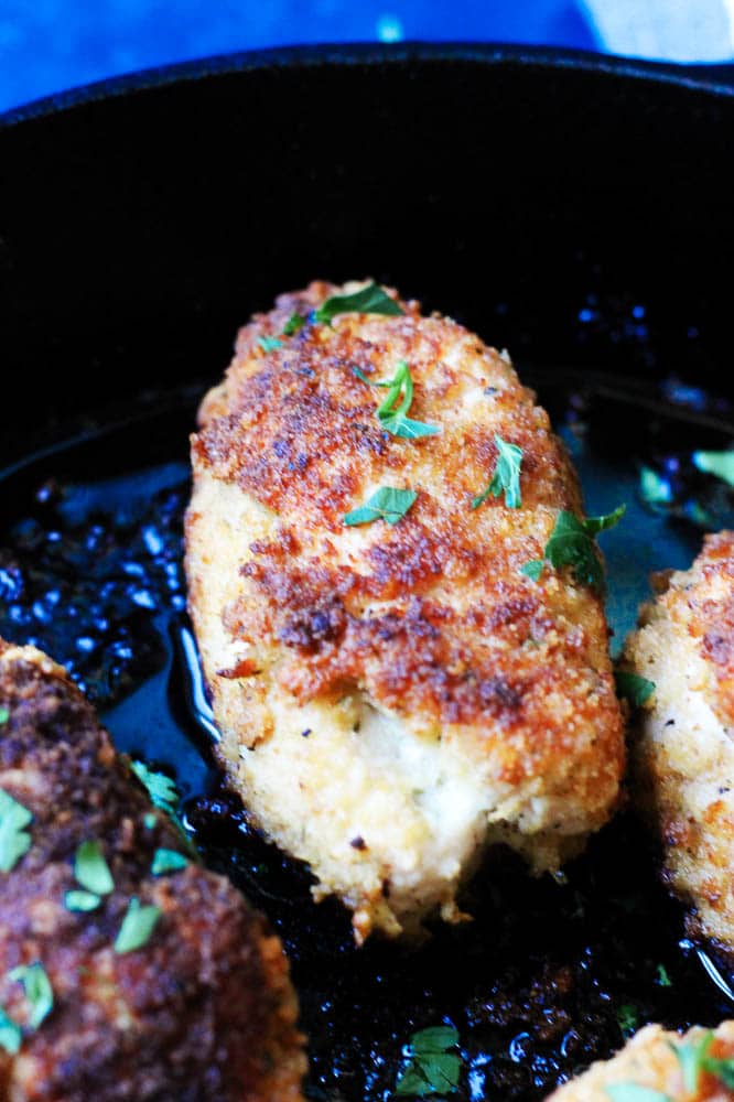 Close up photo of chicken kiev in a skillet