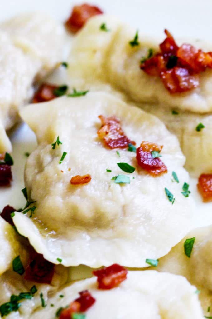 Close up shot of Pierogi with Meat topped with bacon bits