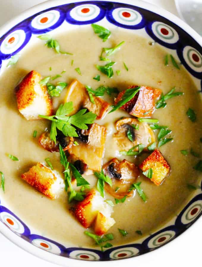 Cream of Mushroom Soup with Croutons and sliced mushrooms in a bowl