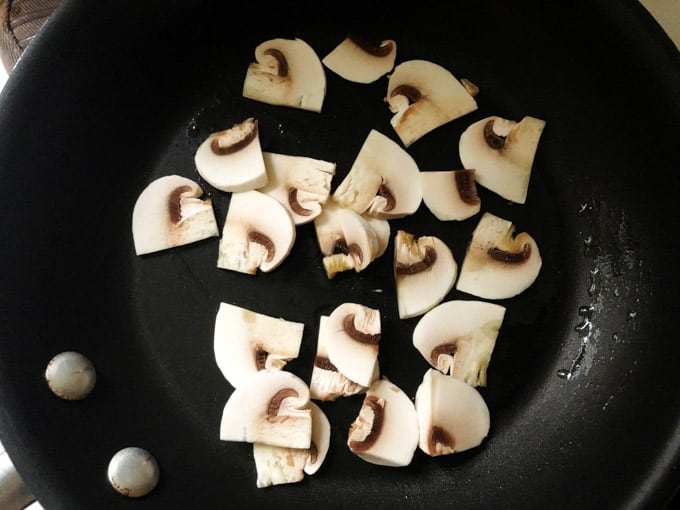 Sliced mushrooms on a pan