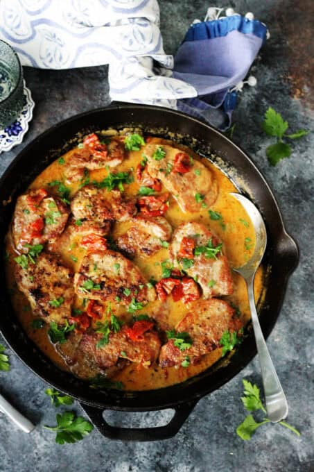 Pork tenderloin medallions in a skillet